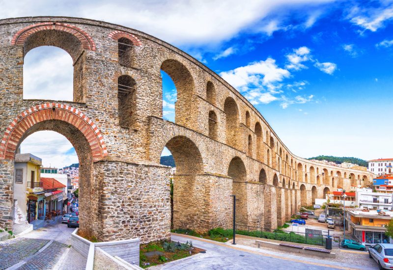 Cityscape with medieval aqueduct Kamares in the Kavala city, Macedonia, Greece.